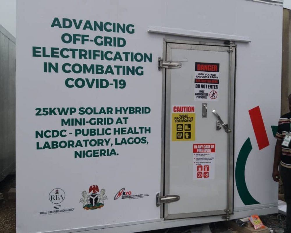 Electricity unit with text printed saying: Advancing off-grid electrification in combating covid-19